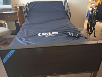 BARELY USED FULLY AUTOMATIC HOSPITAL BED