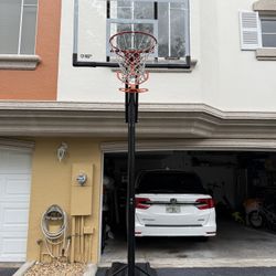 Lifetime 55 Inch Steel Frame Shatterproof Portable Action Grip Adjustable Basketball Hoop