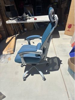 Blue office chair with headrest