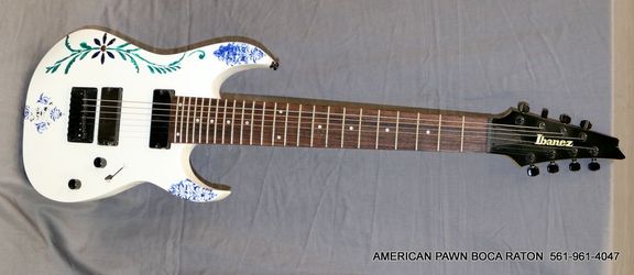 Ibanez RG8 8-string electric guitar with a custom blue and green floral finish painted back  