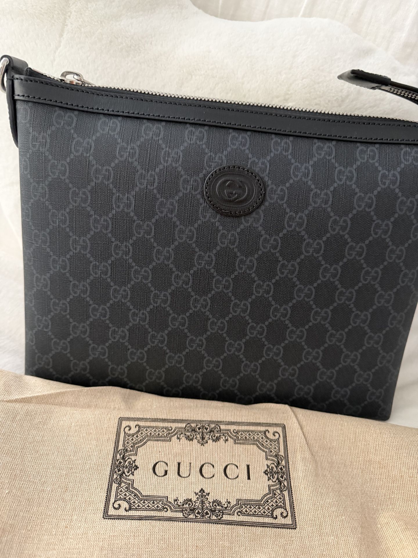 Gucci Men’s or women’s satchel bag.