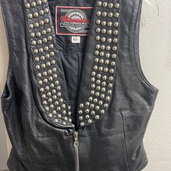 Leather studded and patched vest