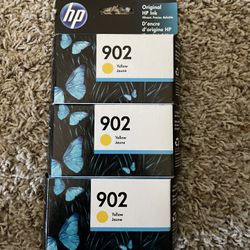 Three HP yellow ink cartridges