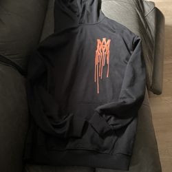 Black and orange spray paint amiri hoodie