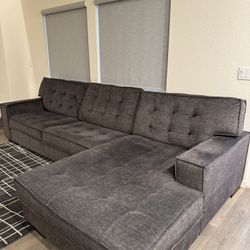 L-shaped couch and rug