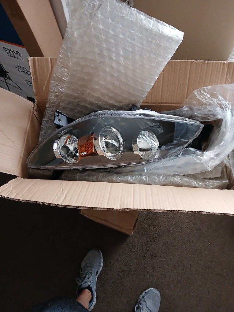 Brand New 2005 Mazda 3 PAIR of Headlight Housing