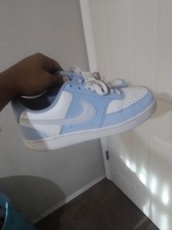 Blue Nike skate shoes