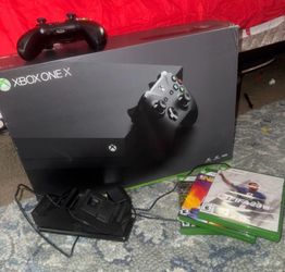 Xbox One x And Extra remote with charging station