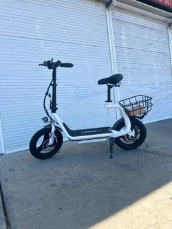 Electric scooter with a seat