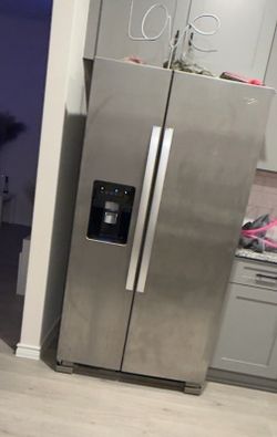 two stainless steel refrigerators