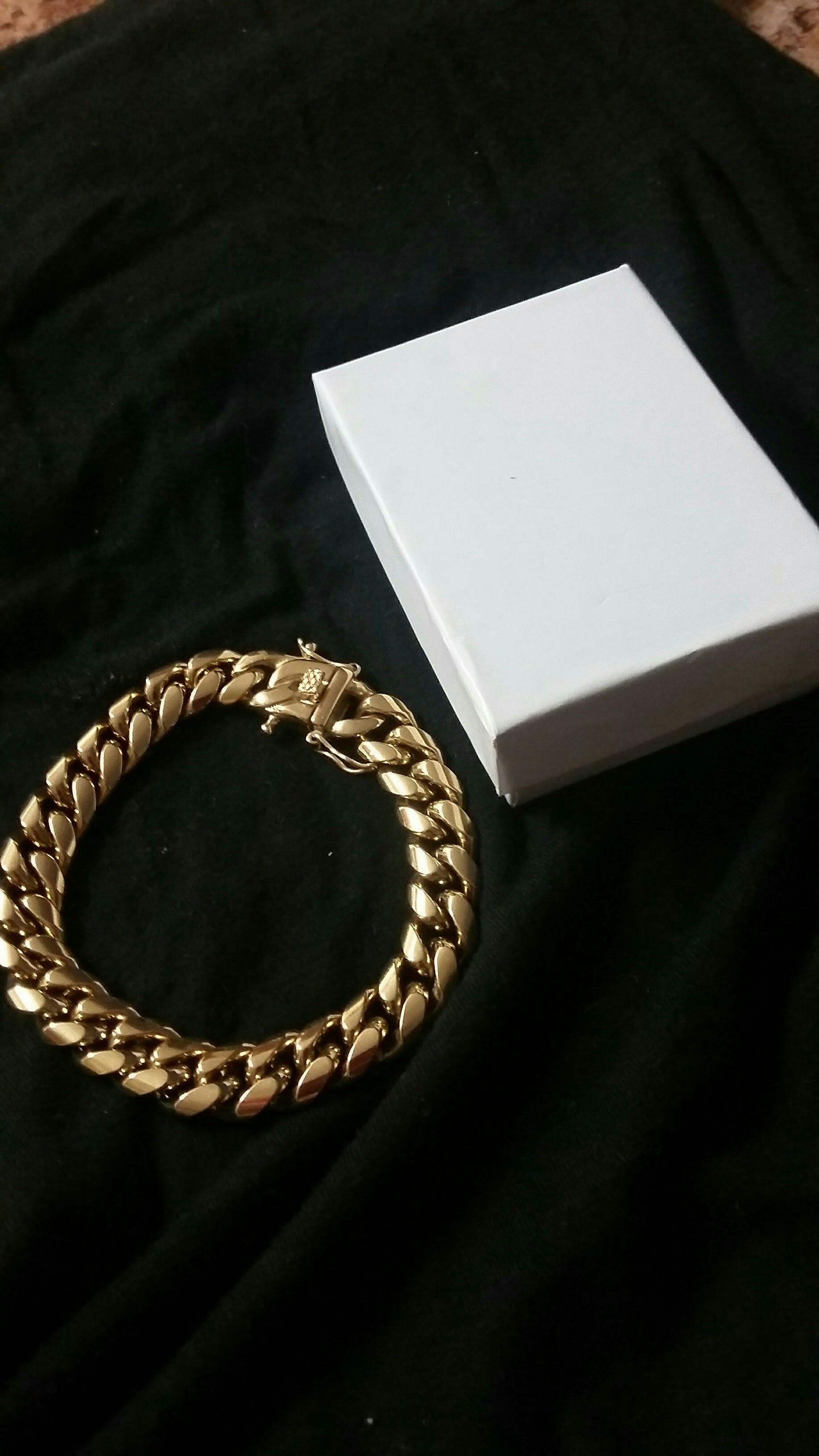 Very nice 14kt gold over stainless steel 12mm by 9inch long Miami Cuban link bracelet for sale !!