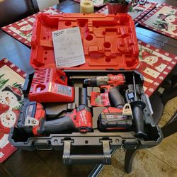 Milwaukee( new)M18 FUEL 18V Lithium-Ion Brushless Cordless Hammer Drill and Impact Driver Combo Kit (2-Tool) with 2 Batteries.(Firm on price))
