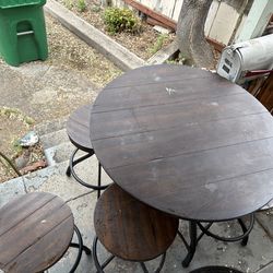 Adjustable height table and chairs .