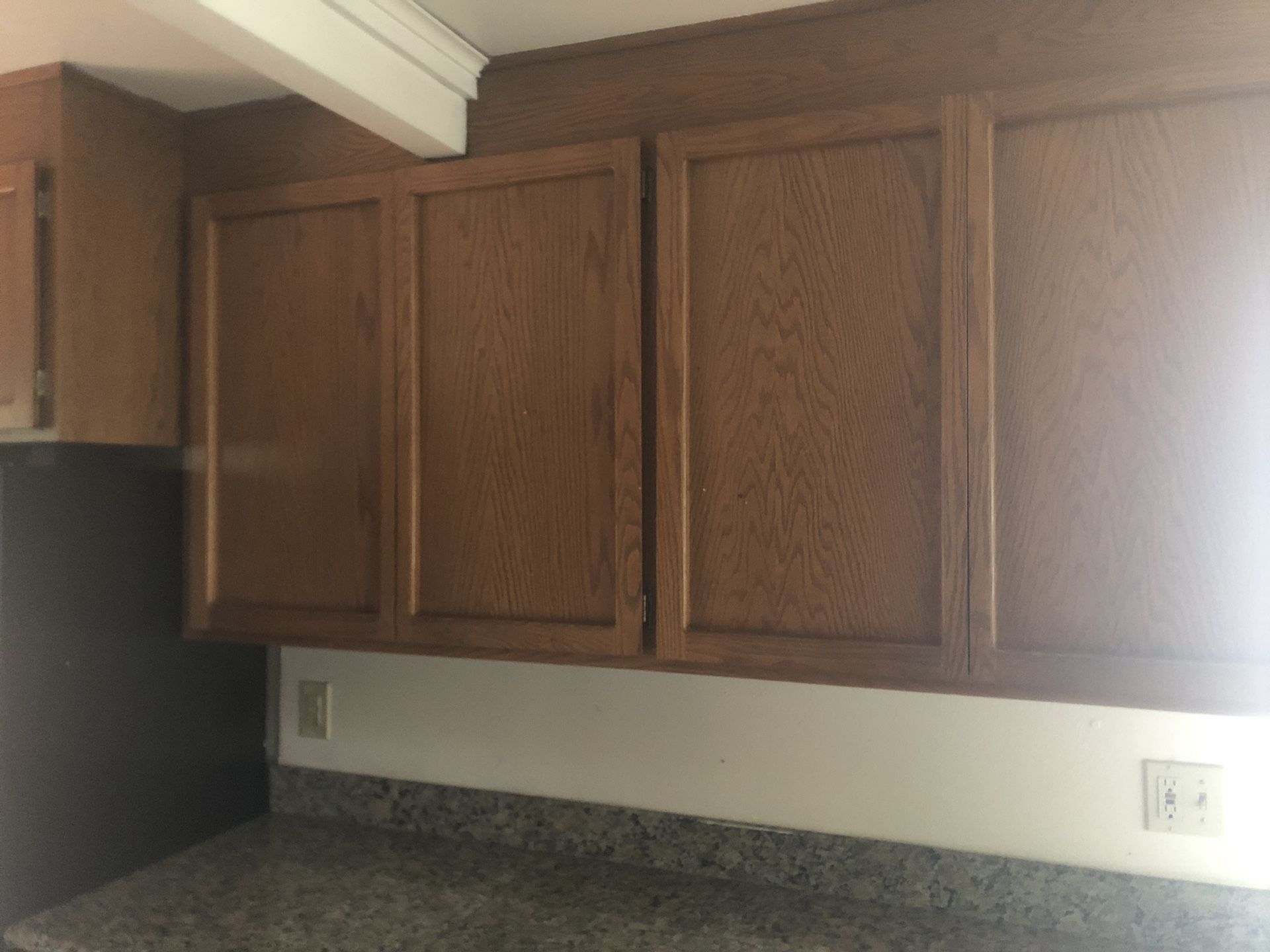 Oak kitchen cabinets with granite countertops