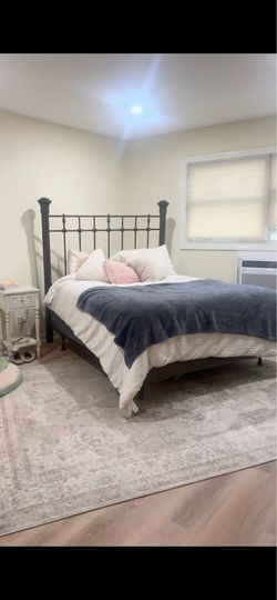 Queen sized bed frame, headboard, and footboard