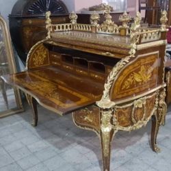 Curio Louis XVI Desk LOOK UP This is a Louis XVI style roll-top desk. TIME PERIOD Late 19th Century ORIGIN France  HISTORY This style of desk is known