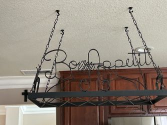 Hanging holder for pans and skillets.