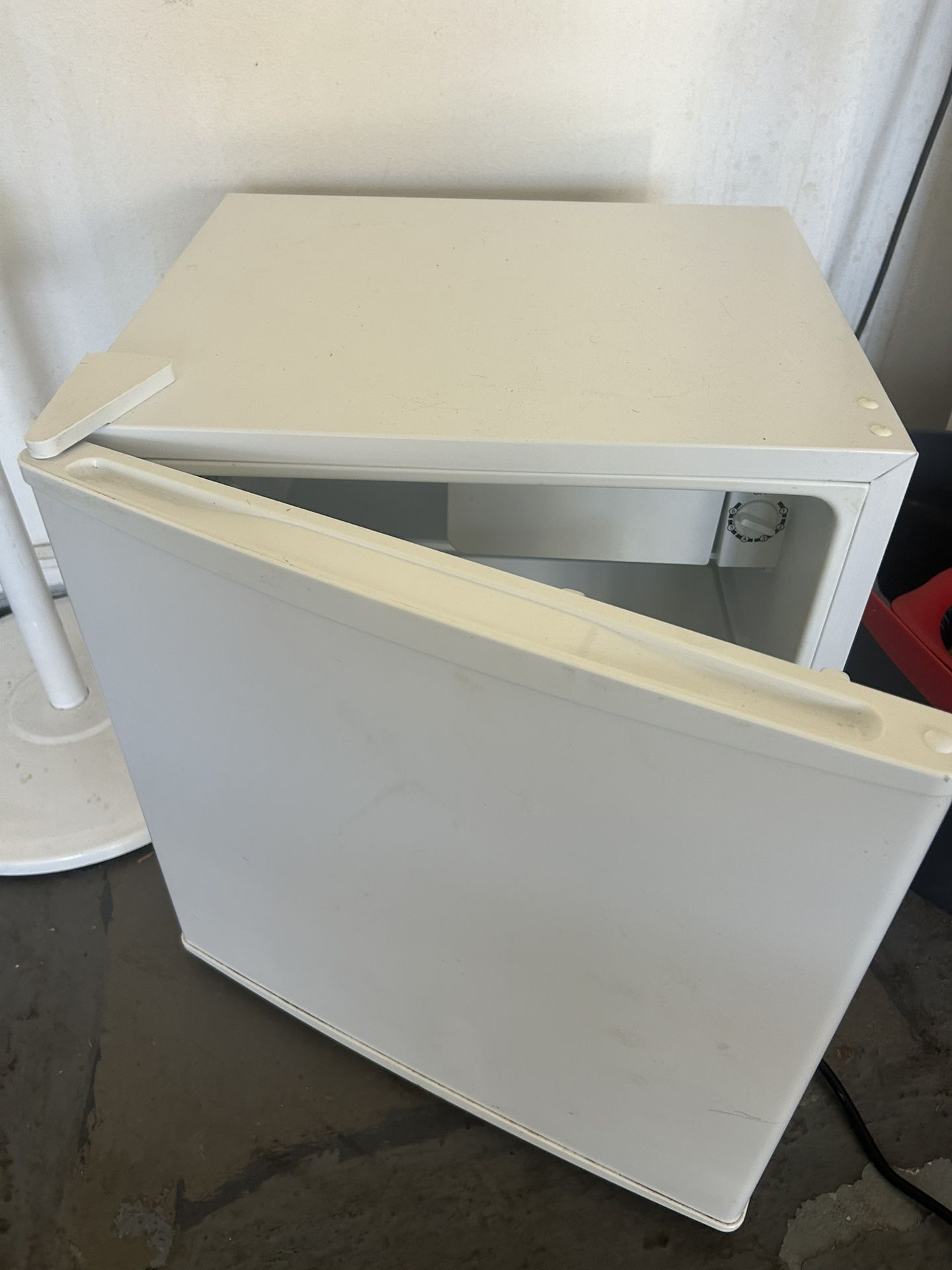 This is an IKEA TILLREDA 43 l freestanding white fridge
