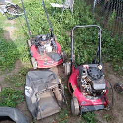 Two Lawn Mowers Need Repair