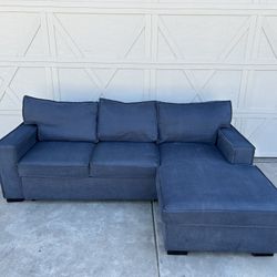 Blue Sectional With Hideaway Ottoman And Storage Chaise