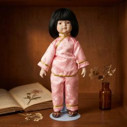 Vintage Porcelain East Asian Child Doll in Pink Pajamas