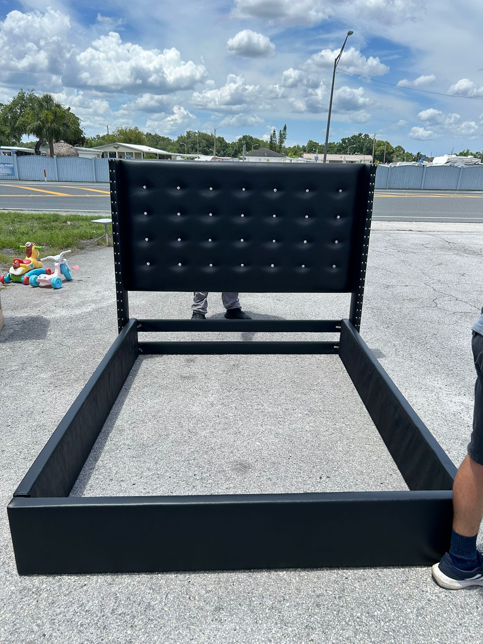 Black upholstered queen bed