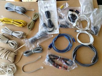 Box of USB cables and phone cords