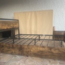 Metal and Fake Wood Bed With 4 Drawers Under It