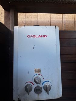 Outdoor cedar shower with gasland propane water heater