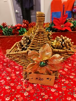 Hand crafted pinecone holiday baskets.  The pinecones are hand picked, cleaned, painted, and then  arranged into 10inch long, 6inch wide and depth  ti