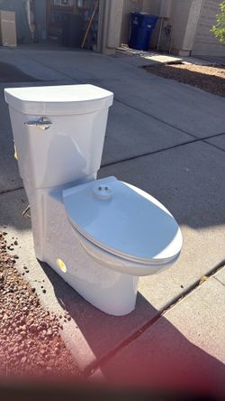 Free American Standard toilet  in perfect condition only about two years old.