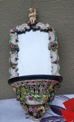 Antique German porcelain wall mirror with all over raised floral decoration
