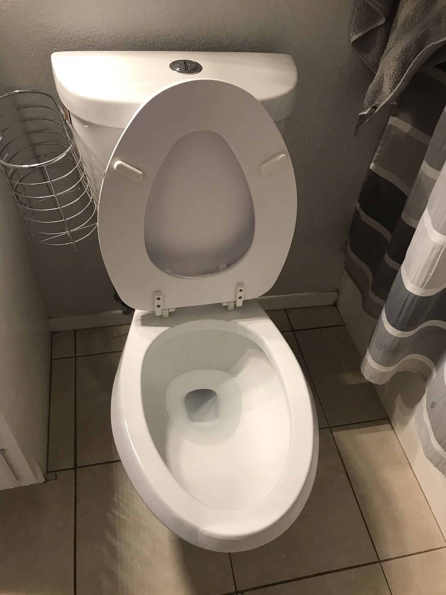 Glacier Bay chair height push button toilet