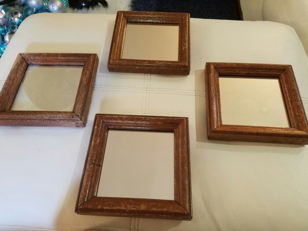 Set of four small wall mirrors