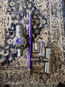 Dyson V6, DC59, SV04, and SV09 cordless stick vacuums. Charger, extra battery and filter.