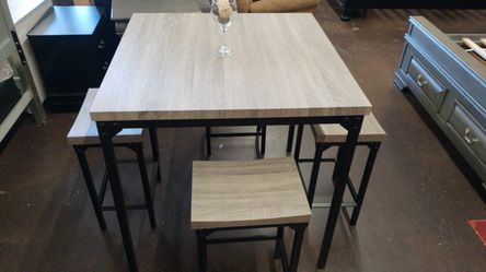 Grey square counter height table with 4 stools