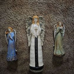 Angel an snowman statue's 