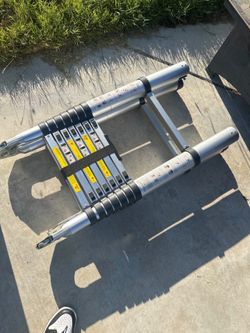 telescoping aluminum extension ladder, approximately 12.5–15.5 ft