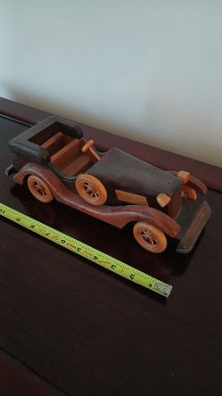 vintage, handmade wooden model of a classic antique car, possibly a 1932 Ford model