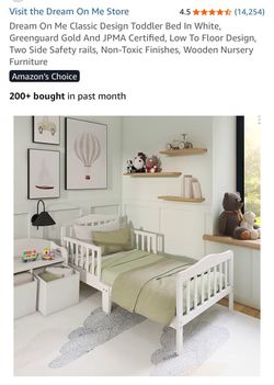 White wooden toddler bed