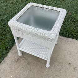 White wicker side table with glass
