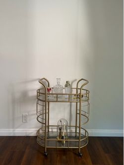 Rolling Golden Bar Cart With Glass Shelf’s