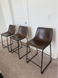 Brown leather bar stools
