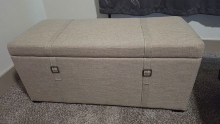 Tan/Cream colored storage ottoman