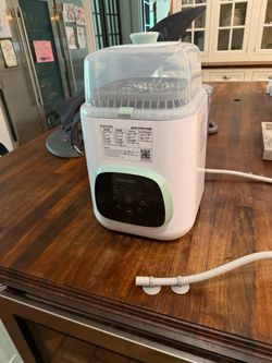Brand new Momcozy Kleanpal Pro Washer + cleaning tablets