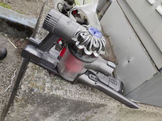 Dyson cordless handheld vaccuum w/ attachments and charger