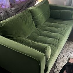 Green velvet couch.