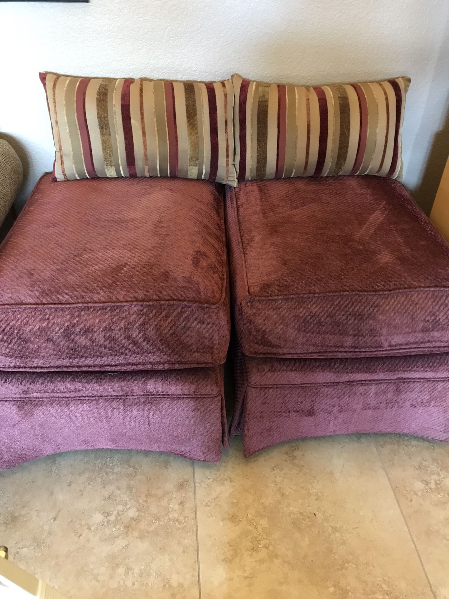 2 Wine-Colored Skirted Ottomans And Pillows