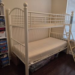 Twin Sized Metal  Bed Frame With A Used Mattress 