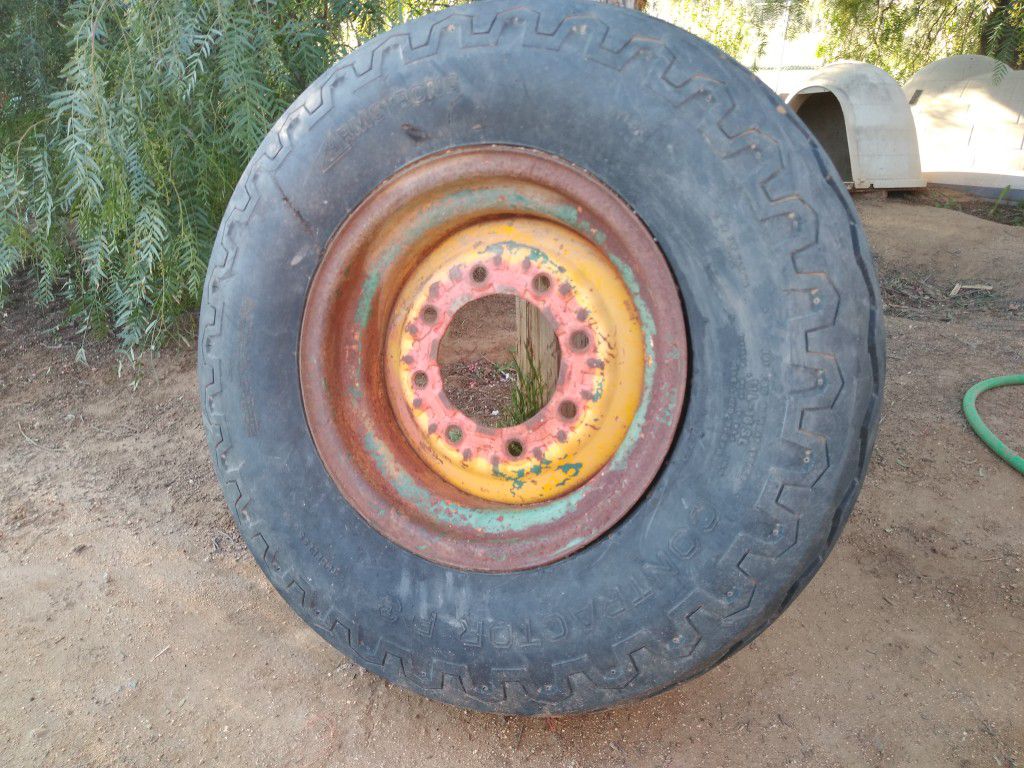 Backhoe tire and rim